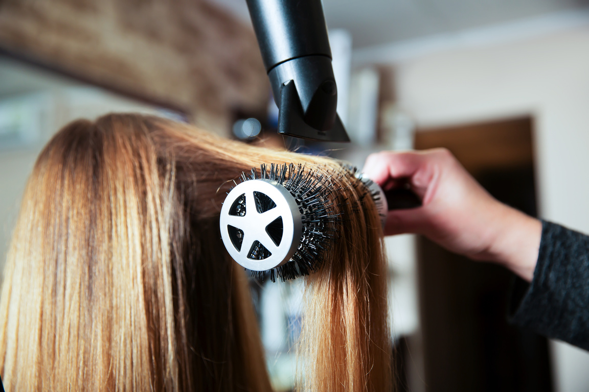 Making Hairstyle Using Hair Dryer.